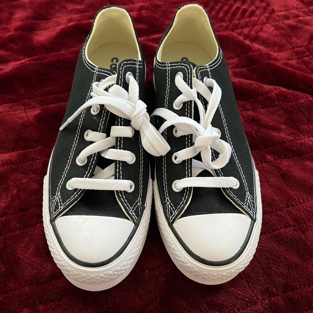 Classic Converse Black and White Chuck Taylor sneakers.